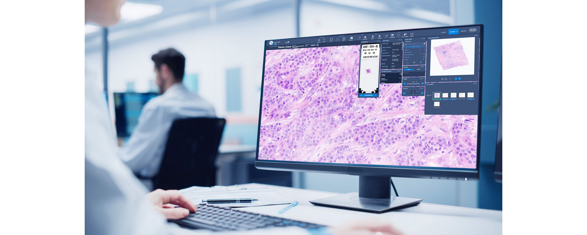 Roche digital pathology solutions lab tech looking at test results