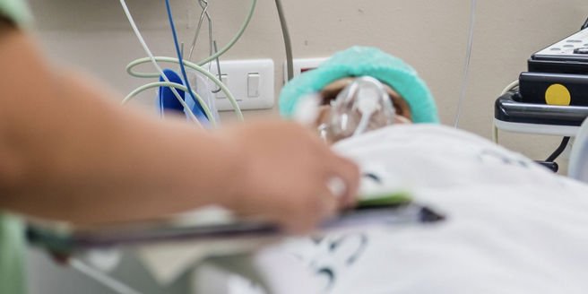 Coronavirus patient in hospital bed