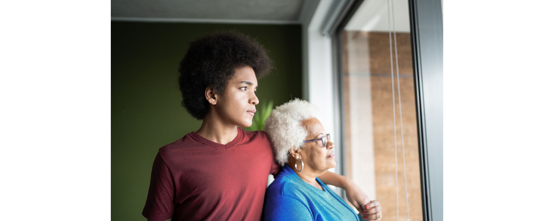 Grandmother and grandson contemplating at home