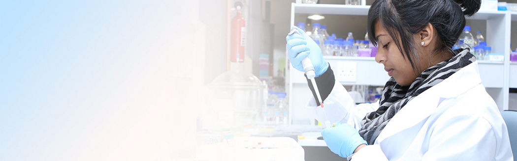 Photo of lab technician at work