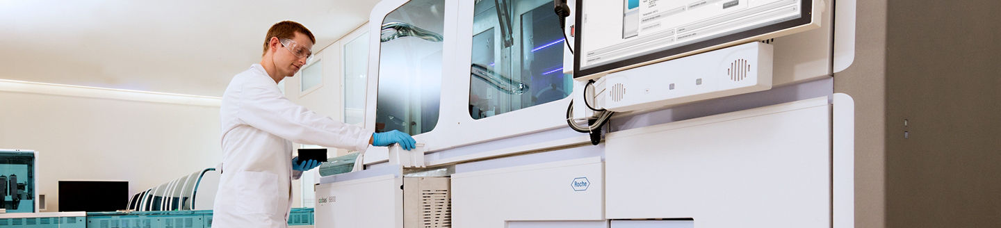 Male lab technician working on cobas® 6800 System