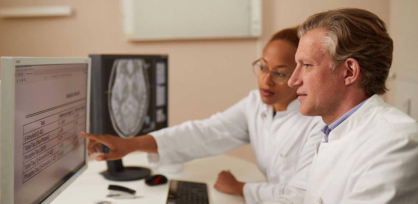 Healthcare professionals looking at a screen