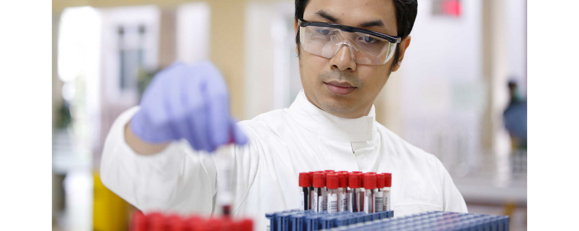 Close up view of person handling blood samples
