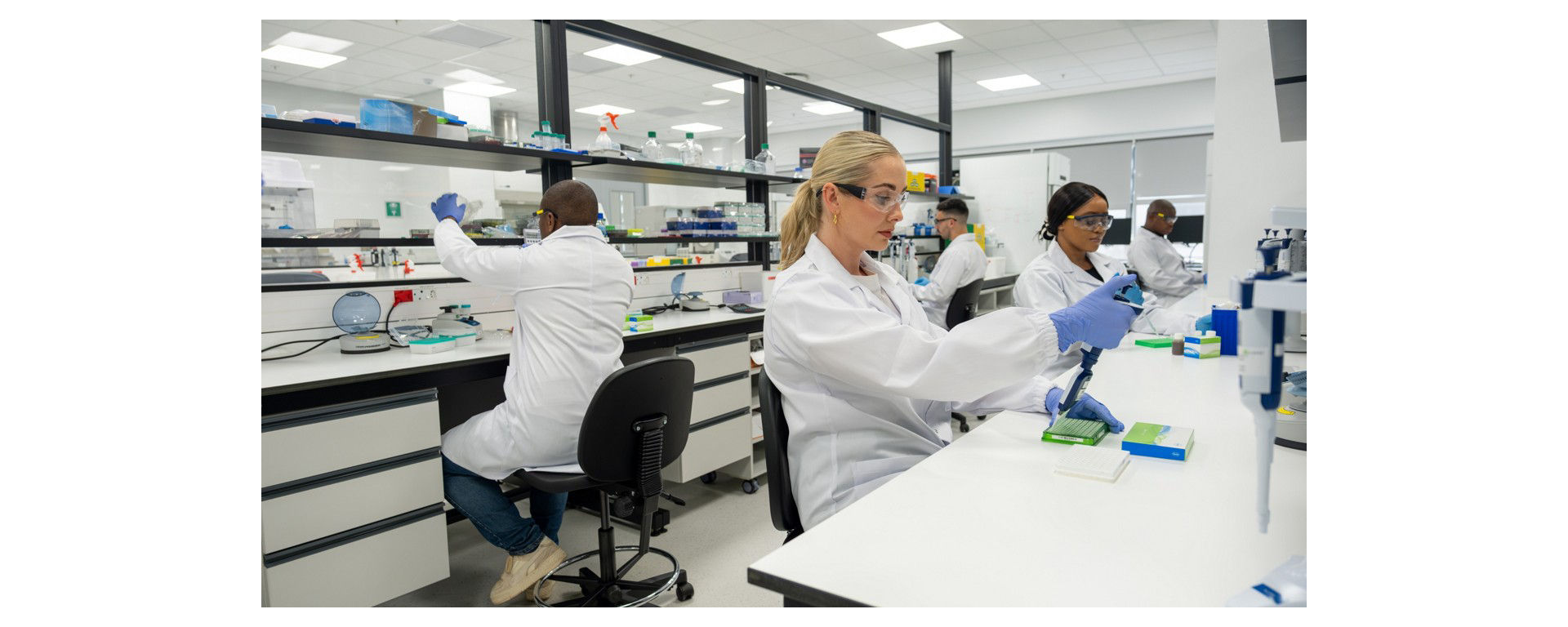 Researchers performing DNA library preparation in a state of the art laboratory using kapa library preparation kit