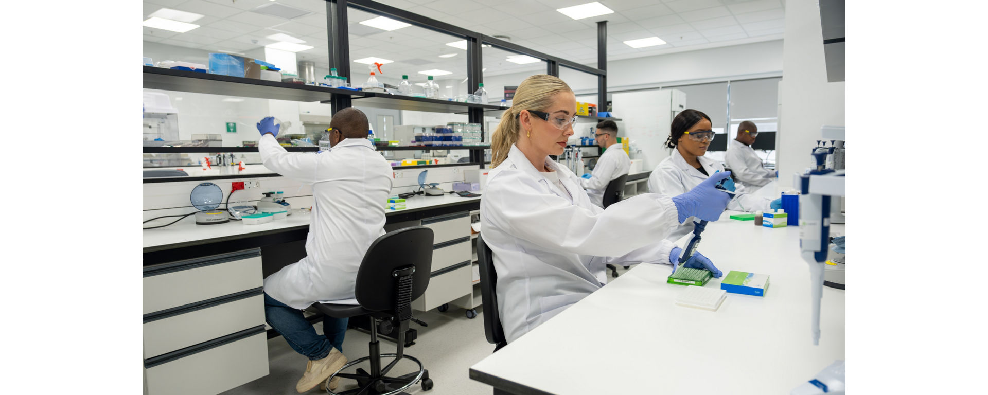 Researchers performing DNA library preparation in a state of the art laboratory using kapa library preparation kit