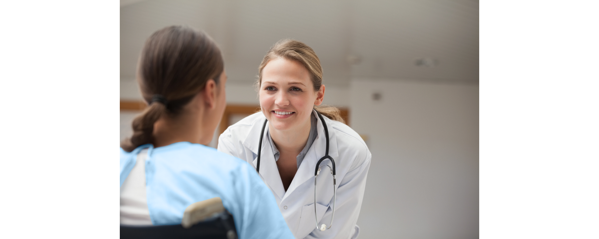 A supportive healthcare provider discusses a personalized MS treatment plan during a patient consultation.