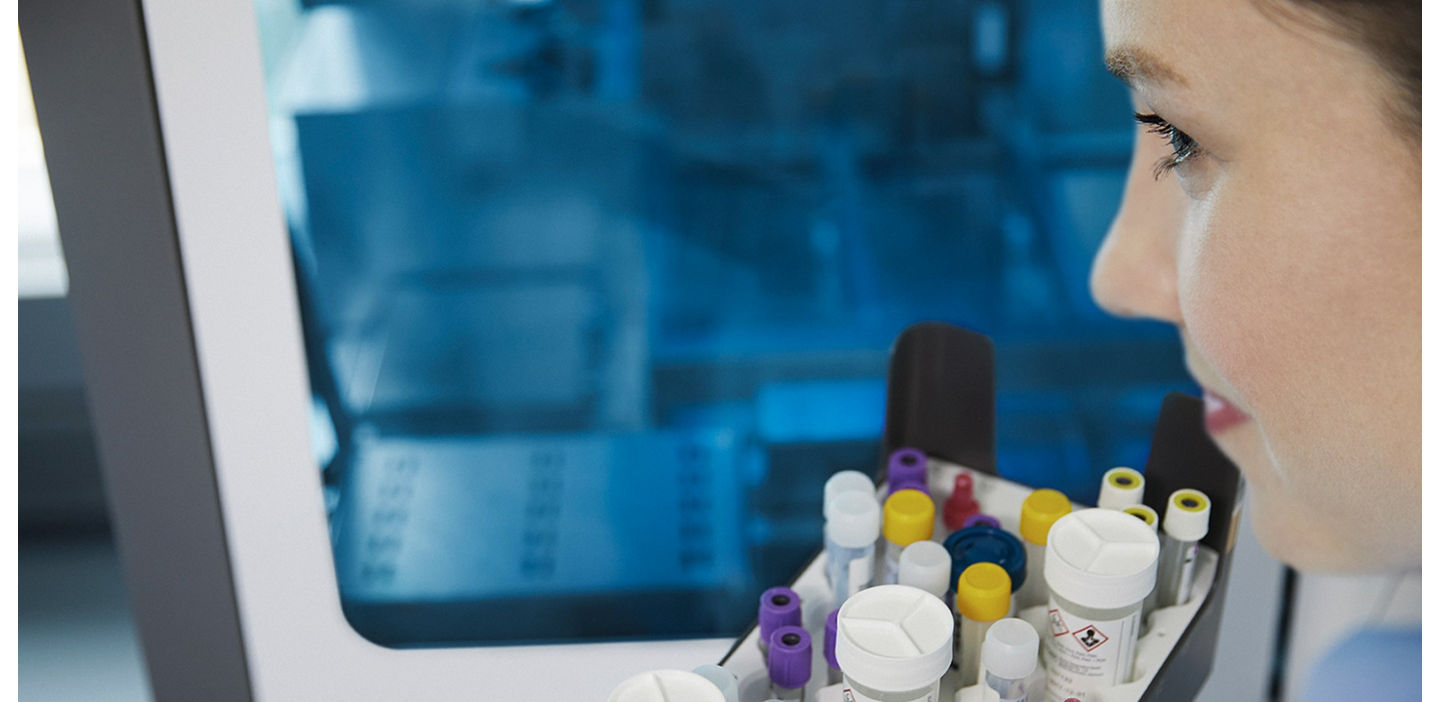 woman working on a molecular pre-analytical system