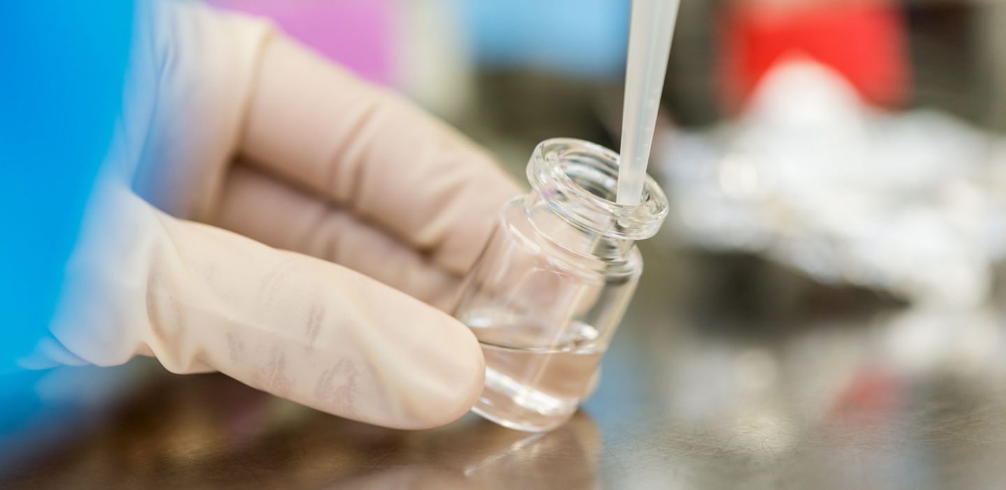 lab workers taking a sample