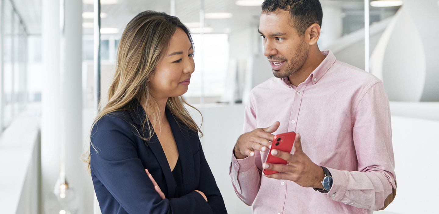 Female and male looking at the phone