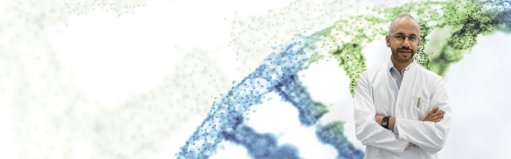 Image of a scientist in a lab coat looking thoughtful