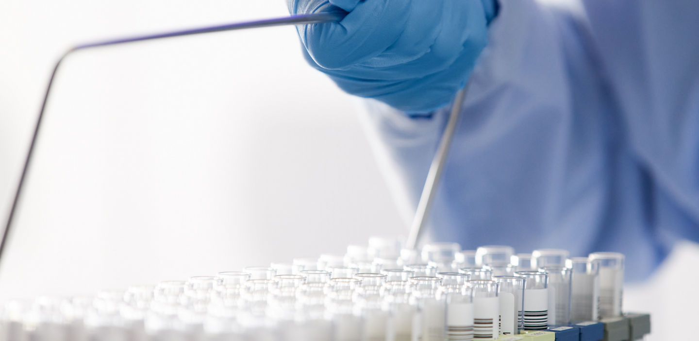 lab workers taking a sample