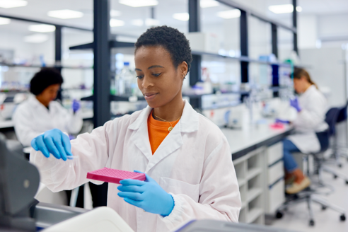 lab technician looking at library quantification samples