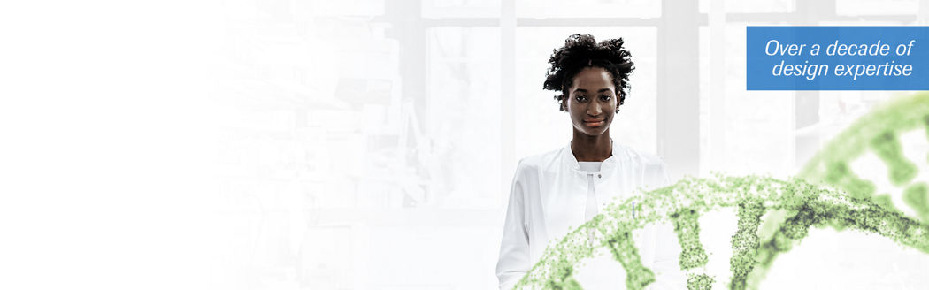 female scientist standing behind DNA helix