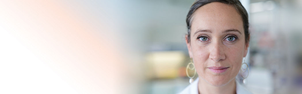 female scientist looking into the camera