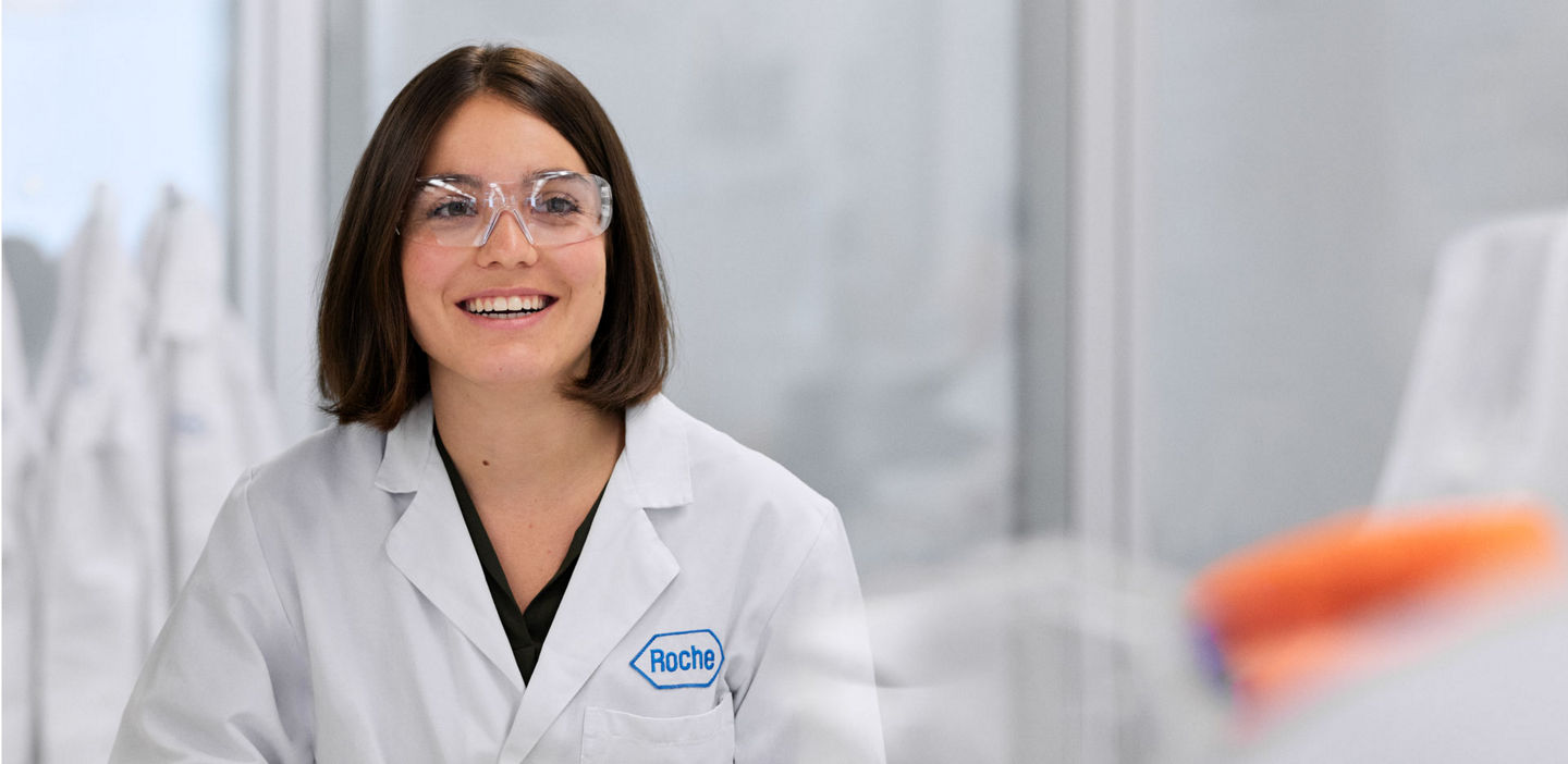Roche scientist smiling in a lab