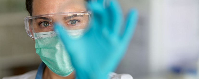 lab technician holding a slide