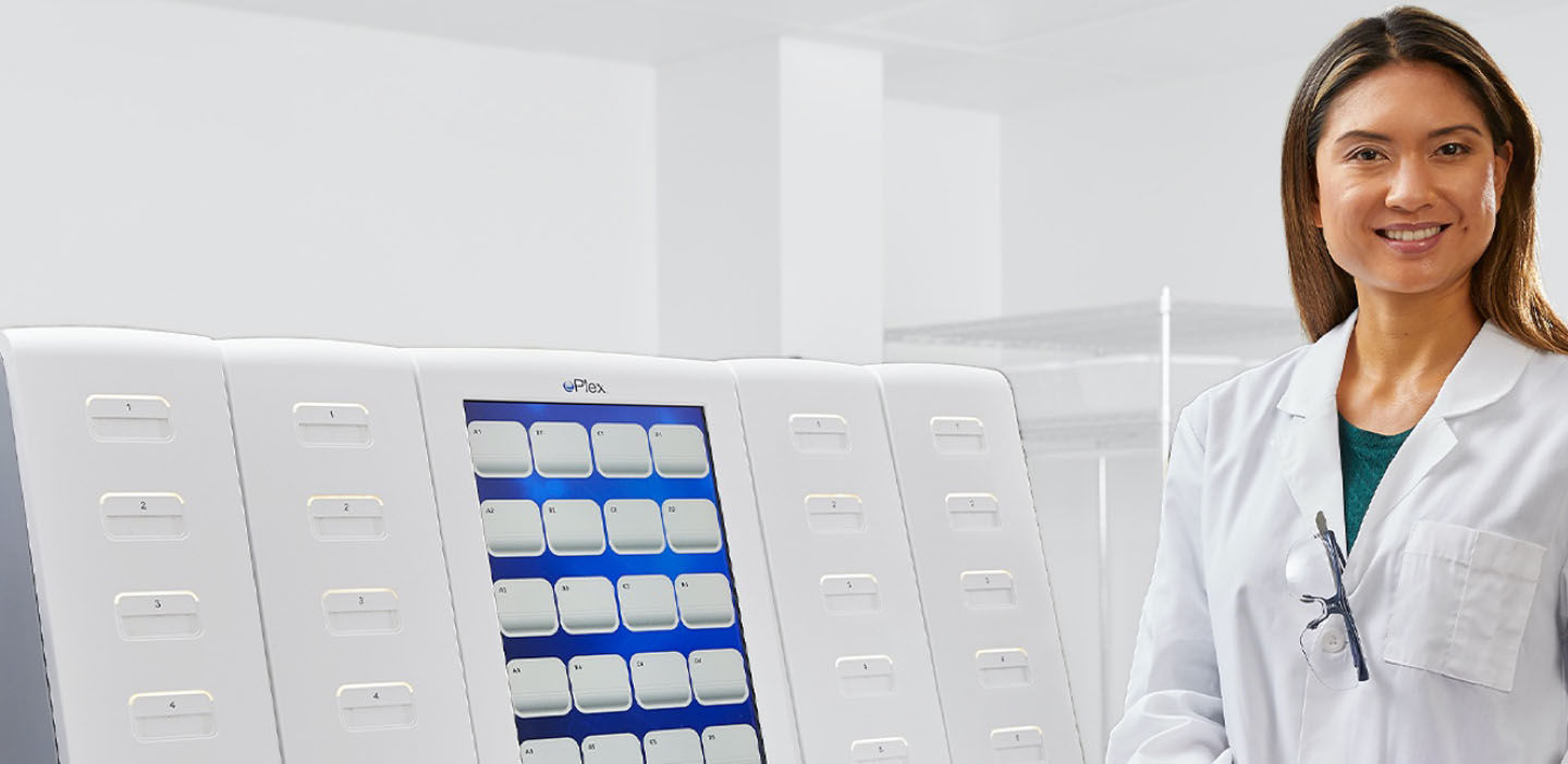 Scientist in front of ePlex System