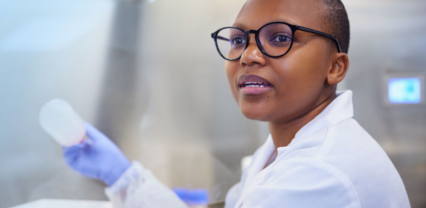 Laboratory worker holding a sample in a lab