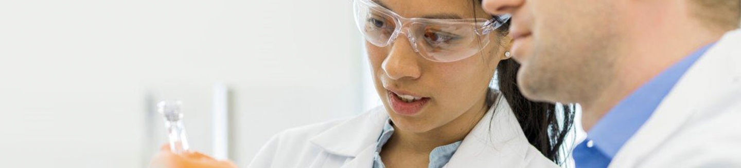 Lab technicians reviewing a sample