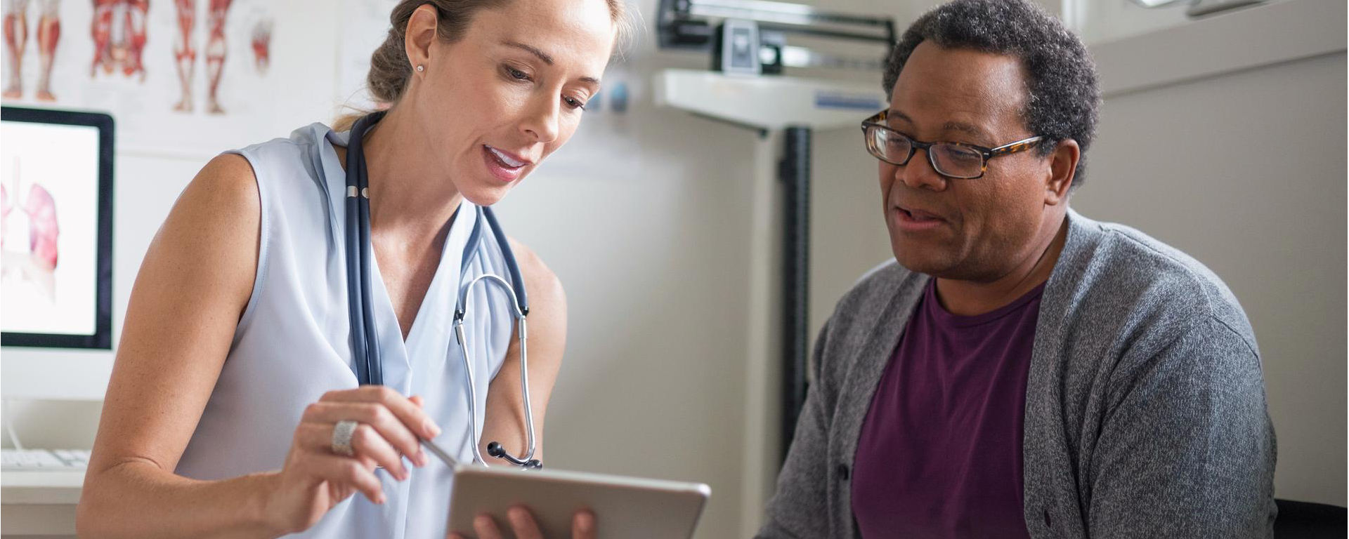 A patient explores cancer treatment options with an oncologist based on his companion diagnostic test results