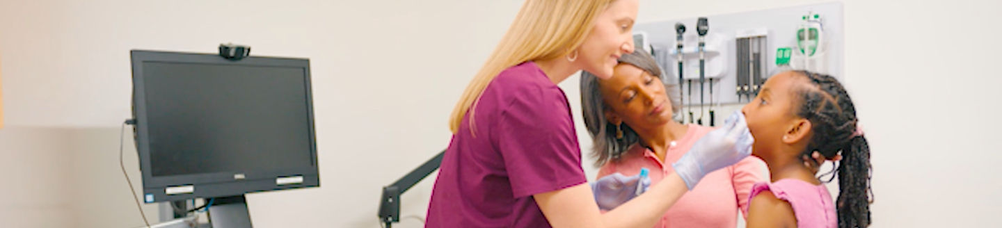 patient doctor and mother in office getting tested