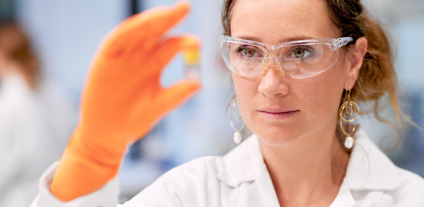 Lab technician touching a screen