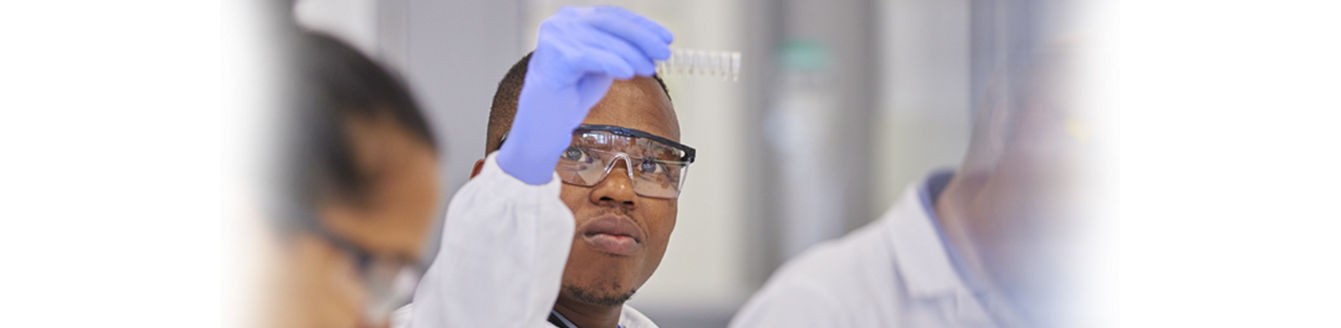 lab technician holding a tray